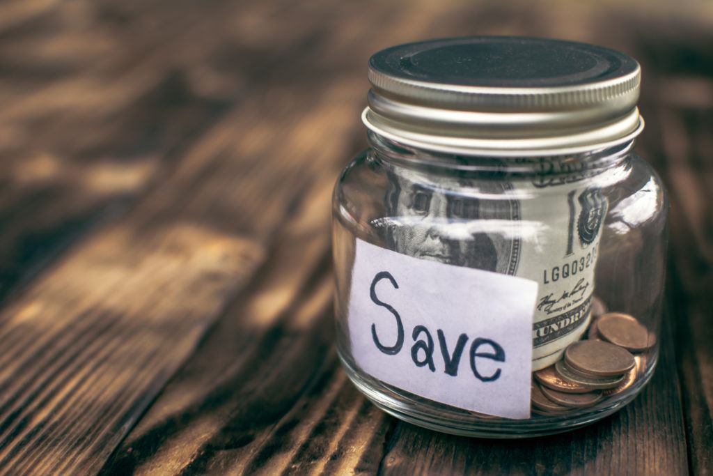 What Changes Are Allowed To Dcap And Health Fsas Due To Covid? 1 close-up of currency in glass jar with text reading "save" on wooden table. dcap and health fsas