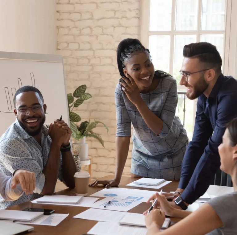 Hr Services In New York 5 a group of people sitting around a wooden table